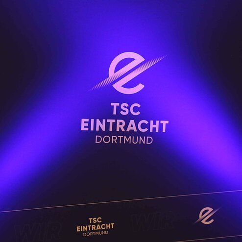 Logo von TSC Eintracht Dortmund vor einem lila Hintergrund mit Lichtstrahlen.