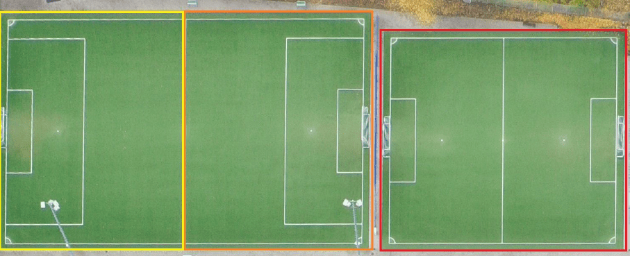 Zwei Fußballfelder aus der Vogelperspektive, eines gelb umrandet, das andere rot umrandet, beide mit Toren und Markierungen.
